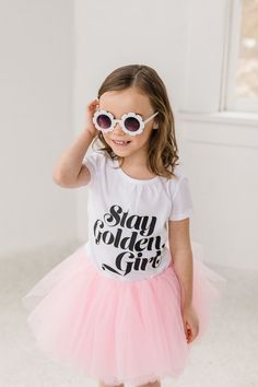 We have the perfect birthday outfit for your special girl! Our Stay Golden Girl Golden Birthday Tutu Outfit is the perfect way to make her day extra special. This outfit features a stunning pink tutu and a stylish "Stay Golden" shirt to match. It's the perfect combination of comfort and style. Plus, it's perfect for any birthday girl!  Your little girl will look and feel like a princess on her special day! We hope you love it as much as we do! This full tutu has ten layers with a wide elastic ba Pink Short Sleeve Tutu Dress For Birthday, Princess Style Short Sleeve Tutu Dress For Birthdays, Princess Style Short Sleeve Birthday Tutu Dress, Princess Style Short Sleeve Tutu Dress For Birthday, Playful Tutu Dress For Birthday In Spring, Playful Spring Birthday Tutu Dress, Spring Birthday Tutu Dress With Short Sleeves, Short Sleeve Tutu Dress For Spring Birthday, Spring Short Sleeve Tutu Dress For Birthday