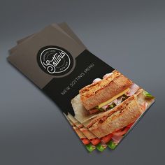 an image of a sandwich brochure that is on top of a gray table