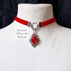 Victorian style choker necklace with quality red crystal and bright red velvet choker. -------------- Details ---------------- - Real oval faceted cut crystal: 13x18mm - Vibrant color: deep red - Antique silver metal claw-set Victorian pendant: 45x25mm - Choker in bright red velvet and stainless steel findings: 32-39cm with the extension to adjust to your convenience (contact me for another length) - Everything is possible: several colors of crystal and velvet are available in my shop, do not he Vintage Red Choker For Party, Silver Vampire Style Choker As Gift, Red Choker For Valentine's Day, Velvet Choker Necklaces, Victorian Pendants, Velvet Choker, Gift Love, Victorian Gothic, Red Crystals