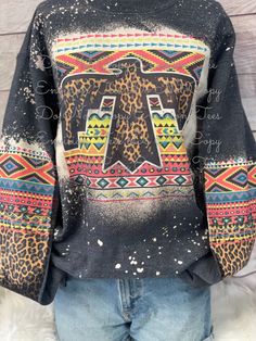 Aztec Leopard Thunder Bird bleached sweatshirt. Unisex fit that runs true to size Multicolor Fleece Crew Neck Sweatshirt, Multicolor Fleece Sweatshirt With Long Sleeves, Multicolor Fleece Long Sleeve Sweatshirt, Multicolor Long Sleeve Fleece Sweatshirt, Multicolor Fleece Crew Neck Top, Multicolor Graphic Print Fall Sweatshirt, Multicolor Long Sleeve Fleece Tops, Multicolor Crew Neck Hoodie For Fall, Bleached Sweatshirt