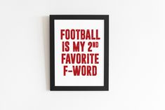 a red and black framed print with the words football is my 2nd favorite f - word