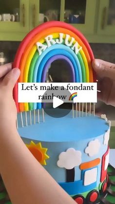 someone is decorating a cake with rainbows on it and the words let's make a fondant rainbow