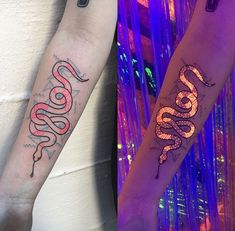 two people with tattoos on their arms and one has a snake tattooed on the arm