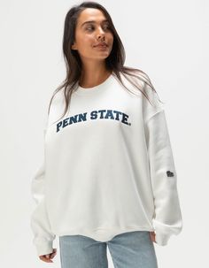 Hype And Vice Penn State University Crewneck Sweatshirt. Applique Lettering At Chest. Embroidered Logo Patch At Left Sleeve. Side Seam Hand Pockets. Ribbed Crew Neckline. Cuffed Long Sleeves And Hem. Fleece Lining. 50% Cotton 49.8% Polyester 0.2% Viscose. Hand Wash. Imported. Model Is Wearing A Size Small. Model Measurements:height: 5'7" Bust: 34"waist: 25"hips: 34.5" Penn State Crewneck, Varsity Tops With Embroidered Graphics And Relaxed Fit, Varsity Tops With Embroidered Graphics For Campus, Varsity Style Embroidered Tops For Campus, Fall Campus Tops With Embroidered Graphics, Varsity Tops With Embroidered Logo For Campus, Varsity Tops With Embroidered Logo For Fall, Collegiate Embroidered Tops For College, Collegiate Relaxed Fit Tops For Campus