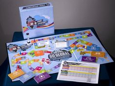 the board game go global is displayed on a blue table with its contents and instructions