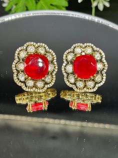 Beautiful Jewelry sure to elevate any look. Feel free to contact me if you have any questions about this item. Formal Chandbali Jeweled Earrings, Bollywood Ruby Round Earrings, Red Bridal Festive Earrings, Festive Red Bridal Earrings For Formal Occasions, Elegant Red Earrings With Stone Work, Vintage Earrings For Formal Festive Occasions, Traditional Party Earrings With Gemstones, Traditional Gemstone Earrings For Party, Traditional Red Clip-on Earrings