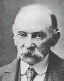 an old black and white photo of a man in a suit with a moustache