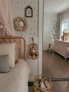 a bedroom with a bed, dresser and mirror in it's centerpieces