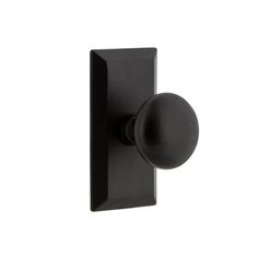 a black door handle with a ball on the front and back of it, against a white background