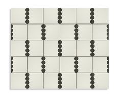 black and white tiles with circles arranged in the same pattern on one side, as well as dots on the other