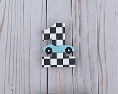 a cake topper with a race car on it