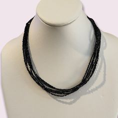 This Is An Absolutely Gorgeous 3-Strand Faceted Black Spinel Bead Sterling Silver Necklace. The Beads Are 2.0 To 2.5 Mm In Diameter. It Measures 34 Inches Long And Can Be Worn As A Long 3-Strand Or A Shorter 6-Strand Necklace. The Clasp And The 2.0 Inch Extender Chain Are Made Of Sterling Silver And Stamped 925 On The Catch Of The Clasp. It Is Also Stamped Bbj For The Manufacturer’s Mark. In Unused Vintage Condition. Elegant Black Rondelle Beaded Necklaces, Black Multi-strand Necklace With Silver Beads, Elegant Beaded Multi-strand Crystal Necklaces, Elegant Multi-strand Beaded Crystal Necklaces, Elegant Multi-strand Beaded Crystal Necklace, Elegant Beaded Multi-strand Crystal Necklace, Elegant Faceted Bead Crystal Necklaces For Party, Elegant Faceted Beads Crystal Necklace For Party, Black Single Strand Necklace For Party