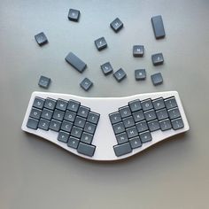 a computer keyboard with many small keys on the top and below it is surrounded by smaller ones