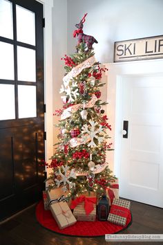 a decorated christmas tree with presents under it