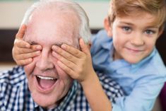 an older man and young boy looking through their eyes