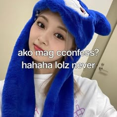 a girl wearing a blue hat and scarf with the words ako mag contes? hahaa loz never