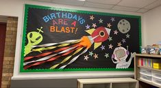 a classroom wall with a birthday sign on it