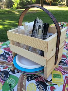 a picnic basket with utensils in it