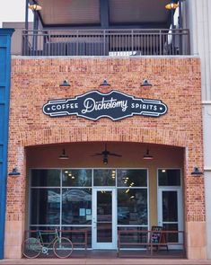 a bicycle is parked in front of a coffee shop