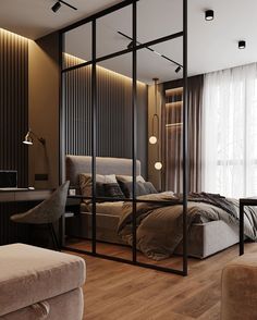 a bedroom with a bed, desk and chair in it's corner area next to a large window