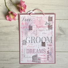 a piece of paper with words on it next to pink flowers and a pair of scissors