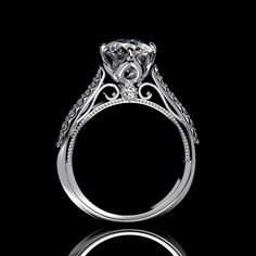 a diamond ring with an intricate design on the side