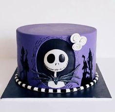 a purple cake with a skeleton on it