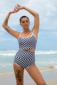 Introducing our latest must-have: the Cropped Tankini featuring the iconic B+W Checkers pattern. With contrast white binding straps, this tankini strikes the perfect balance of style and practicality. So whether you're catching waves or soaking up the sun, this top offers adjustable straps for a comfortable and customized fit. A definite essential for any surf-lover's wardrobe. This is made by our team in Australia Crop Tankini, Checker Print, This Boy, Surf Wear, Short Cut, Italian Fabric, Scalloped Hem, Checkered Pattern, White Trim