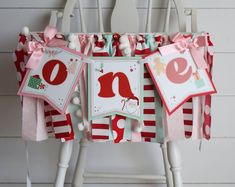 a red and white striped chair with some decorations on it