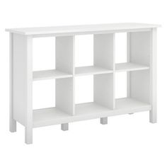 a white bookcase with four shelves on each side and one shelf below the other