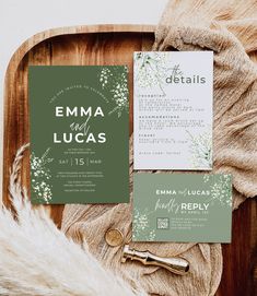 the wedding stationery is laid out on top of a wooden tray with furnishing