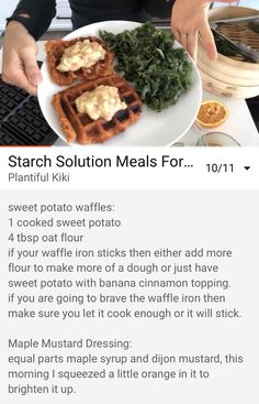 a woman holding a plate with waffles and vegetables on it in front of a keyboard