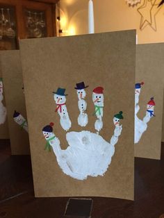 three handprints with snowmen on them