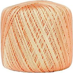 an orange ball of yarn on a white background