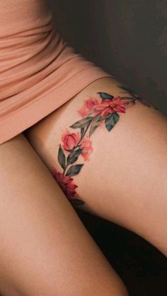 a woman's thigh with flowers on it