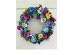 a colorful wreath is hanging on the wall