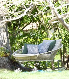 a swing chair hanging from a tree in the middle of a yard with text overlay that reads pasadena showcase showcase showcase house