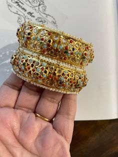 Traditional Jaddau Navratan kadas. These are also known as hydrabadi style or punjabi style Jewlery. These are openable ones. These are 2.4 but will fit 2.6 and on preorder order can be done in any size and color customised. Kangan Gold, Punjabi Style, Gold Plated Bangles, Gold Plate, Bangles, Plating, Gold, Quick Saves, Color