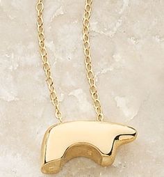 ENCLOSED MAMA BEAR NECKLACE  The original Golden Bear. 14k yellow gold. The Bear measures 7/8" x 3/8" and is on a 28" continuous, medium-weight chain. Enclosed-bottom. It is tradition to wear our Golden Bear pendants facing your heart.  $850.00 Mama Bear Necklace, Bear Jewelry, Golden Bear, All That Glitters Is Gold, Bear Pendant, Bear Necklace, Papa Bear, Twisted Wire, Fabulous Jewelry