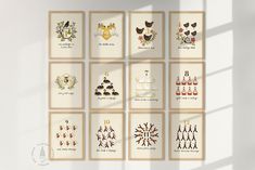 six cards with different designs on them are arranged in a grid pattern against a white wall