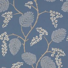 a blue wallpaper with white flowers and leaves on it's side, in front of a gray background