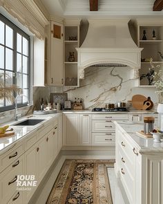 a large kitchen with white cabinets and marble counter tops on the walls, along with an area rug