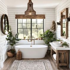 a white bath tub sitting under a window next to a sink in a room with wooden floors