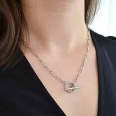 Beautiful, handmade, non-tarnish & durable stainless steel silver toggle clasp necklace with a 4mm paperclip chain that will keep its color, even when worn in the water! 💎Free shipping on all orders💎Waterproof and non-tarnish💎Packaging that is ready to offer as a gift💎Customizable chain length A front clasp toggle necklace, the perfect addition to your jewelry collection This luxurious, statement-piece toggle clasp necklace is the perfect finishing touch to your outfits. Layer it with other Gift Paperclip Chain Toggle Necklace, Sterling Silver Chain Necklace With Toggle Clasp, Silver Toggle Necklace With Paperclip Chain, Elegant Paperclip Toggle Necklace, Elegant Nickel-free Metal Toggle Necklace, Toggle Necklace, Trombone, Toggle Clasp, Chains For Men