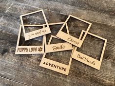 wooden cutouts with sayings on them sitting on a table