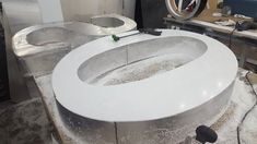 a white counter top sitting inside of a kitchen next to a sink and stovetop