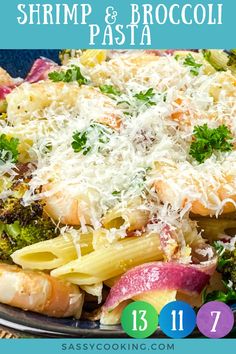 shrimp and broccoli pasta with parmesan cheese on top in a blue bowl