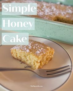 a piece of honey cake on a plate with a fork next to it and the words, simple honey cake