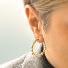 Introducing our Twisted Gold Hoop Earrings, the perfect accessory to elevate your look. Crafted with precision, these large hoop earrings exude modern sophistication and make a bold statement. The unique twisted design adds a touch of texture, making them stand out from ordinary hoop earrings. With their 18k gold plated finish, these earrings exude luxury and elegance. Whether you're dressing up for a special occasion or adding some flair to your everyday style, these Twisted Gold Hoop Earrings are the must-have accessory for the fashion-forward individual. size - 35mm Please visit our shop for more gold and silver jewellery. https://www.etsy.com/uk/shop/OnnanokoCo Texture Jewelry, Hoop Earrings Large, Large Hoop Earrings, Jewelry Earrings Hoops, Gold Hoop, Gold Hoop Earrings, Everyday Style, Step Up, Statement Earrings