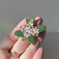 A hard enamel pin with a gold metal base. ~1.5 inches with dual rubber clutches. Massachusetts' state flower. The Mayflower. Part of my USA state flower series. Originally hand drawn digitally on Procreate. *Open Edition Flower Enamel Pin, Spring Flower Enamel Pin Gift, Spring Flower Enamel Pin As A Gift, Spring Flower Enamel Pin For Gift, Pink Flower Enamel Brooch, Gold Flower Enamel Pin Gift, Gold Flower Enamel Pin For Gift, White Flower-shaped Enamel Pin, Flower Shaped Enamel Pin